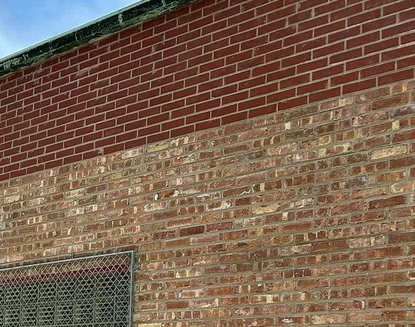 Brick reset and repointed above the new steel