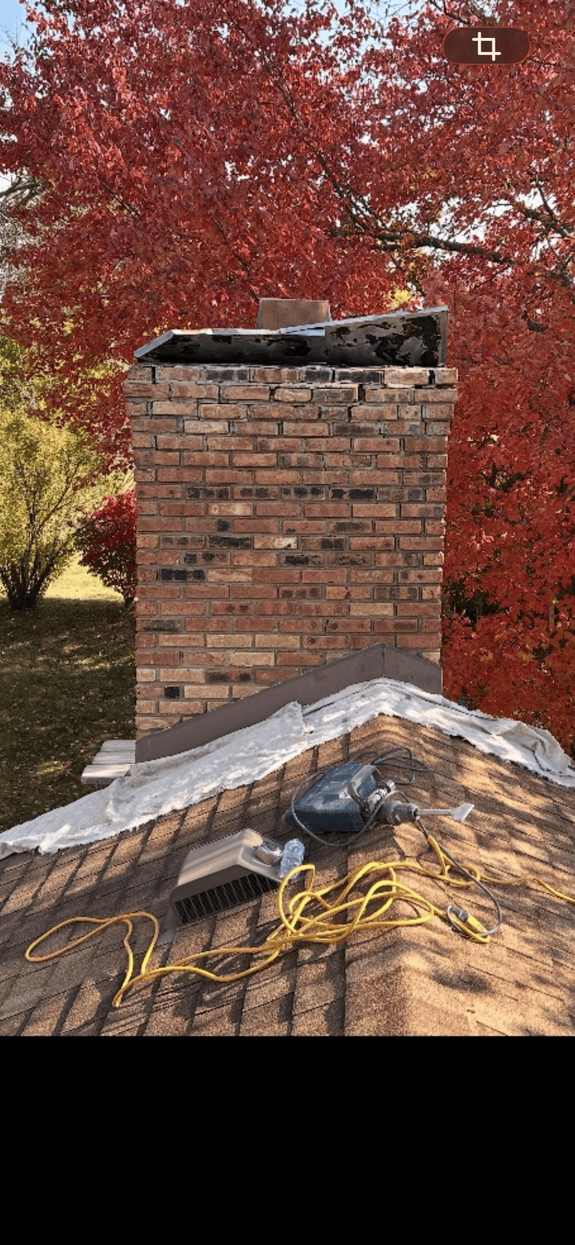 Chimney tuckpointing in progress