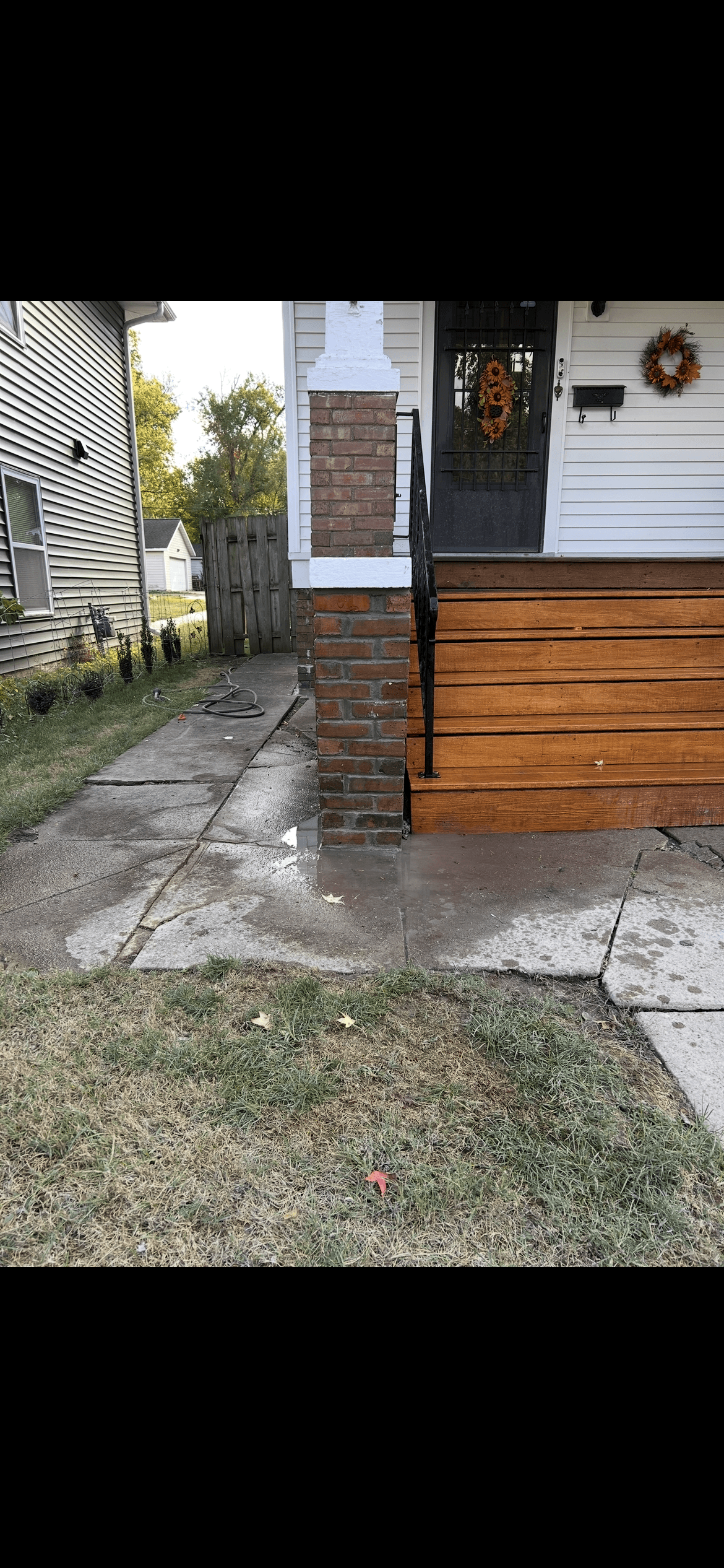 Before: failed joint repointing on brick façade